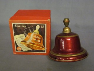 An LBZ metal musical bell shaped spinning top marked Liederkreisel D.P.A Song Top boxed