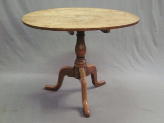 A circular 19th Century bleached oak snap top tea table, 36 1/2"