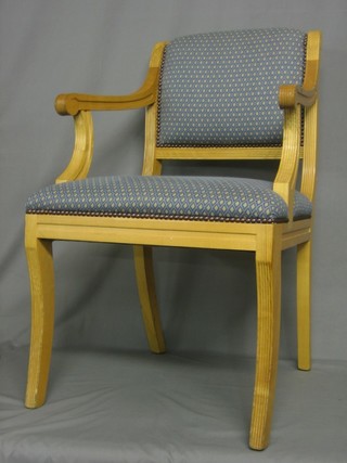 A set of  8 light oak Georgian style open arm chairs