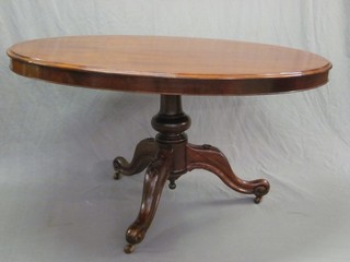 A Victorian oval snap top Loo table, raised on pillar and tripod supports 56"
