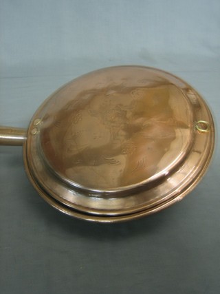 An 18th/19th Century copper warming pan with turned fruitwood handle
