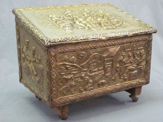 A  rectangular embossed brass coal box with hinged lid decorated a tavern scene 17"