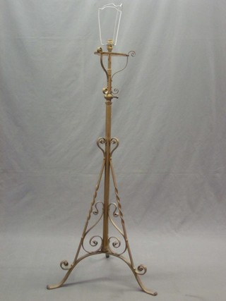 A 19th Century gilt painted adjustable oil lamp stand