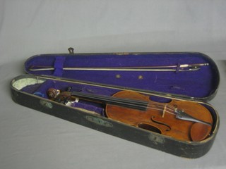 A wooden violin with single piece back and complete with bow, label marked made by George Crask 1878, sold by C H Crompton Manchester AD 1892 14", contained in a wooden carrying case 