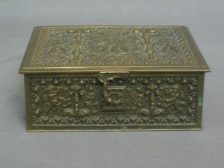 A gilt metal trinket box decorated cherubs with hinged lid 8"