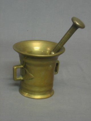 A twin handled bell metal mortar and pestle 4"