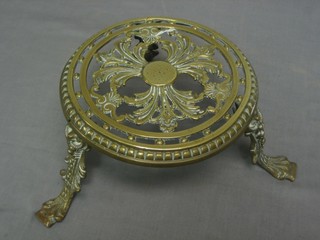 A 19th Century circular pierced brass trivet 8"