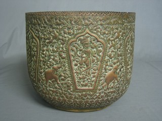 A cylindrical Eastern embossed brass jardiniere 12"