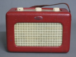 A Roberts portable radio contained in a red fibre case