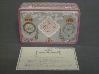 A slice of HRH Prince of Wales and HRH Duchess of Cornwall wedding cake 9 April 2005, contained in a metal tin complete with greetings card and original brown paper box