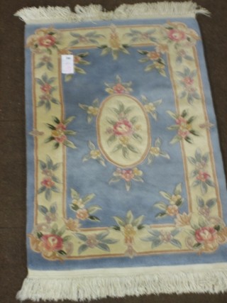 A blue ground and floral patterned Chinese rug 48" x 30"