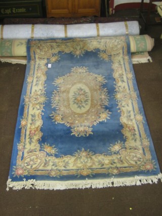A blue ground and floral patterned Chinese rug 110" x 71"