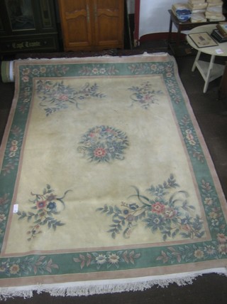 A white ground and floral patterned Chinese carpet 145" x 109"