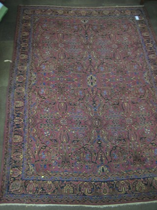 A contemporary Turkish plum ground carpet with all-over design 147" x 105"