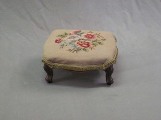 A Victorian mahogany stool with Berlin wool work seat, raised on cabriole supports 12"