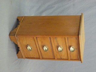 A pine pedestal chest of 4 long drawers, raised on bracket feet 16"