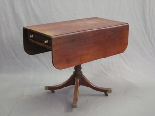 A 19th Century mahogany pedestal Pembroke table, the base fitted a drawer and raised on pillar and tripod supports 35"