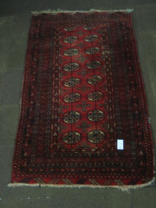 An Afghan Bokhara style rug with 16 octagons to the centre