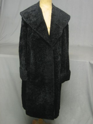 A lady's black full length Astrakhan fur coat