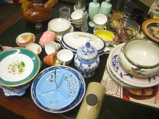A brown glazed Prices Pottery egg store in the form of a seated hen, a pair of Victorian opaque green glass vases, a stoneware hotwater bottle, various decorative plates etc