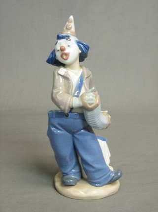 A Nao figure of a clown with accordion 8"