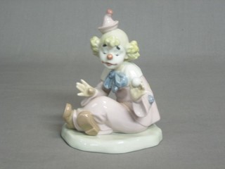 A Nao figure of a seated clown 6"