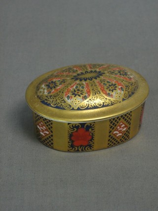 An oval Royal Crown Derby Old Imari pattern jar and cover, the lid marked 1128 LIX 2"
