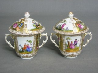 A pair of Dresden style twin handled chocolate cups and covers, the base with R cypher 3"