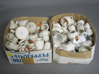 2 shallow boxes containing a collection of crested china