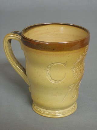 A Doulton commemorative 1/2 pint mug in the form of a Georgian 1646 tankard, the base marked Philips Oxford Street London Doulton Lambeth (slight crack to handle)