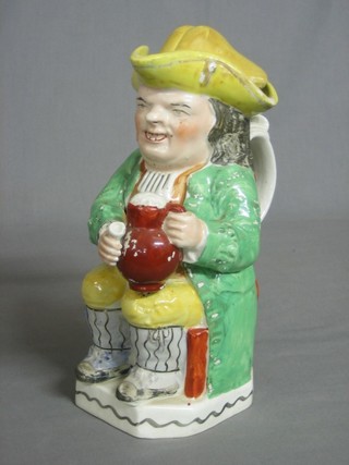 A 19th Century Staffordshire Toby jug in the form of seated Toby Philpot 10"