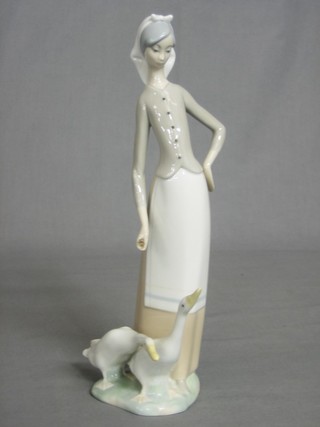 A Lladro figure of a lady with geese 10" (f)