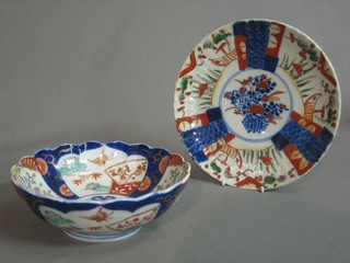 A circular 19th Century Japanese Imari porcelain bowl, the base with seal mark 7" (chip to rim) and a Japanese Imari porcelain plate 8 1/2" (chipped)