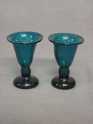 A pair of blown green glass trumpet shaped glasses 3"