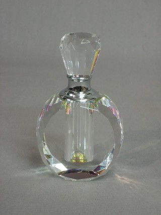 An oval faceted glass scent bottle and stopper 4"