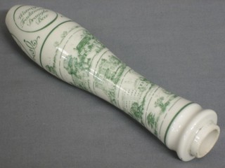A porcelain green and white beer engine head decorated buildings and marked Watneys Traditional Draft Beer 8"
