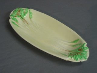 A Clarice Cliff twin handled celery dish 12" (chipped)