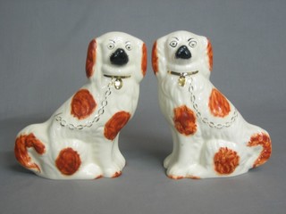 A pair of Blakeney porcelain figures of seated Spaniels 8"