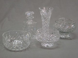 A cut glass spirit decanter and stopper, a waisted cut glass vase and 3 cut glass bowls