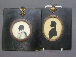 2 silhouette portraits of gentleman contained in black and gilt frames