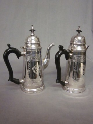 A cylindrical silver plated coffee pot with hot water jug