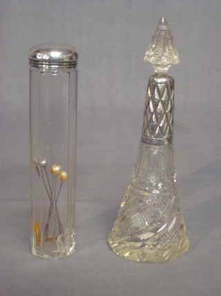 A cylindrical cut glass pin jar with silver lid and a scent bottle with silver lid