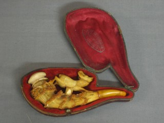 A carved Meerschaum cheroot holder in the form of a deer with amber mount
