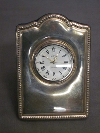 A modern silver cased travelling clock 2 1/2"