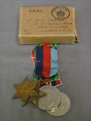 A group of 4 medals to A D M Taylor comprising 1939-45 Star, Africa Star, Defence & War medal, with original box of issue 
