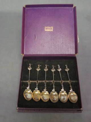 A set of 6 silver coffee spoons decorated golfers, Birmingham 1922 contained in a Harrods case 2 ozs
