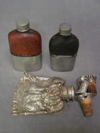 2 glass hip flasks, a silver plated purse and 2 silver plated bottle stoppers