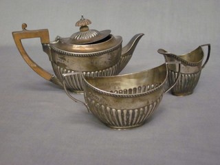 A Victorian silver 3 piece Bachelor's tea service of oval form with demi-reeded decoration, Sheffield 1898 12 ozs