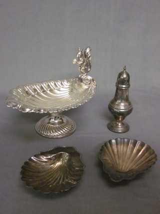 A scallop shaped nut dish decorated a squirrel, a pair of scallop shaped butter dishes and a silver plated sugar caster