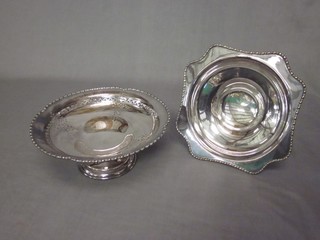 A circular pierced silver plated dish and 1 other